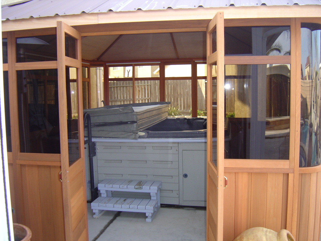 hot tub enclosed by cedar wood gazebo